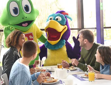 Family eating breakfast at the Character breakfast at Cadbury World