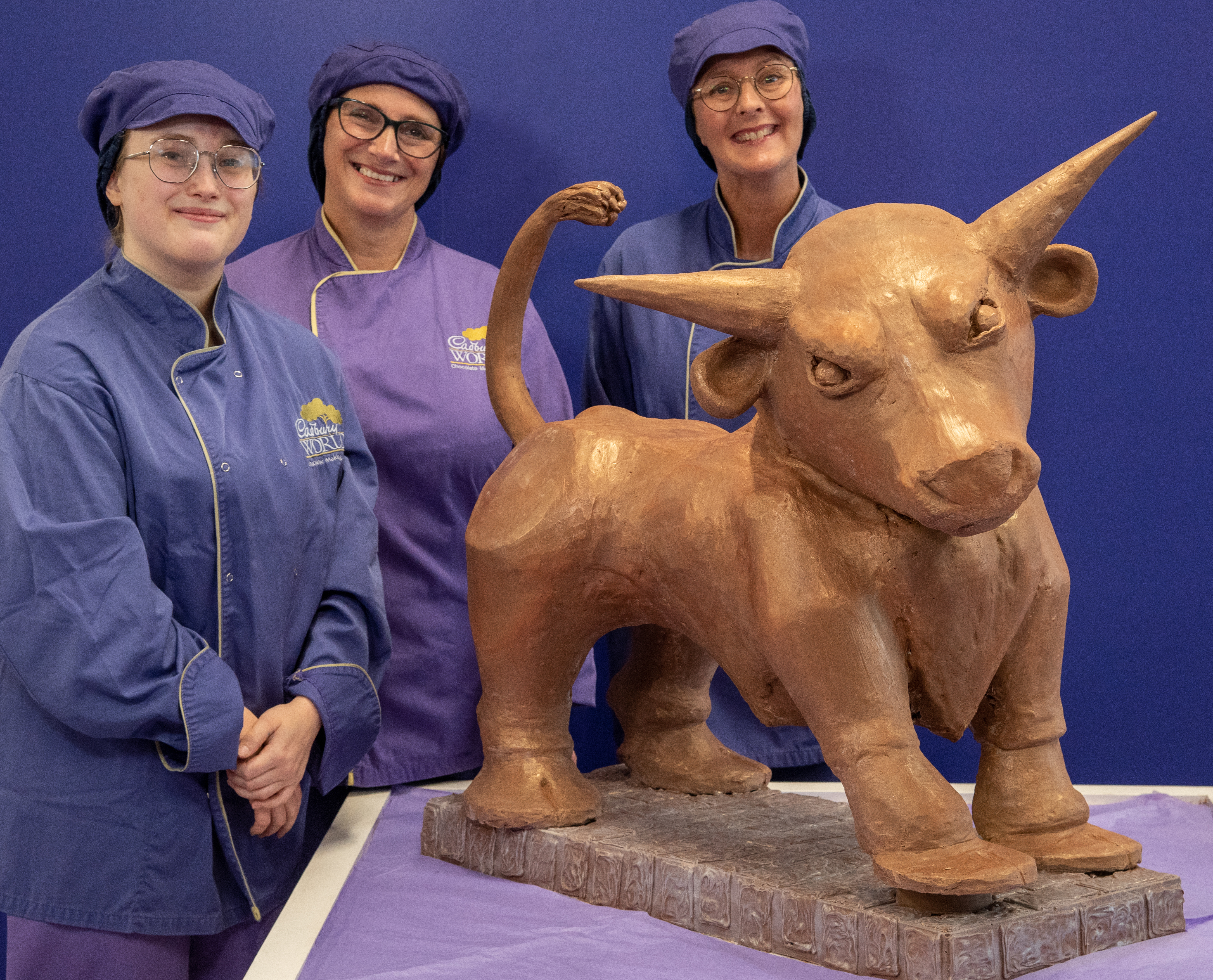 Cadbury World chocolatiers Donna Oluban, Eloise Dowell and Dawn Jenks with the iconic Bull creation