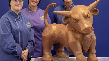 Cadbury World chocolatiers Donna Oluban, Eloise Dowell and Dawn Jenks with the iconic Bull creation