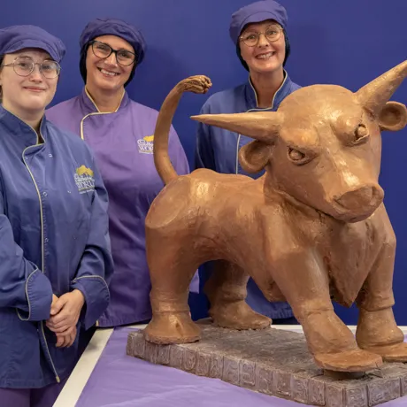 Cadbury World chocolatiers Donna Oluban, Eloise Dowell and Dawn Jenks with the iconic Bull creation